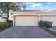 Two car garage with brick paver driveway at 14439 Prunningwood Pl, Winter Garden, FL 34787