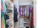 Organized walk-in closet featuring ample shelving and hanging storage for clothes and accessories at 14439 Prunningwood Pl, Winter Garden, FL 34787