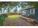 Fenced backyard with deck and mature trees offers privacy at 1618 Robertson St, Lakeland, FL 33803