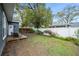 Fenced backyard with deck and mature trees offers privacy at 1618 Robertson St, Lakeland, FL 33803