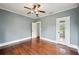 Comfortable bedroom featuring hardwood floors and a ceiling fan at 1618 Robertson St, Lakeland, FL 33803