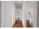 Bright hallway with hardwood floors leads to other rooms at 1618 Robertson St, Lakeland, FL 33803