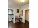 Hallway featuring antique table and view into a kitchen at 1618 Robertson St, Lakeland, FL 33803