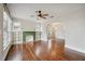 Bright living room with hardwood floors, decorative fireplace, and large windows at 1618 Robertson St, Lakeland, FL 33803