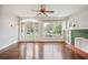 Bright living room with hardwood floors, fireplace, and large windows at 1618 Robertson St, Lakeland, FL 33803