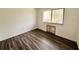 Bedroom with wood laminate flooring, window overlooking the exterior and neutral colored walls at 1700 6Th Nw St # A36, Winter Haven, FL 33881