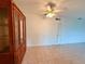 Dining room shows ceiling fan and built-in wood cabinet for ample storage and display at 1700 6Th Nw St # A36, Winter Haven, FL 33881