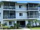 Exterior view of a three-story apartment building in a landscaped setting at 1700 6Th Nw St # A36, Winter Haven, FL 33881