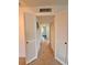 Hallway featuring ceramic tile flooring, closet space and entry to other rooms at 1700 6Th Nw St # A36, Winter Haven, FL 33881