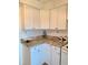 Kitchen featuring white cabinets and granite countertops at 1700 6Th Nw St # A36, Winter Haven, FL 33881