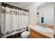 Bathroom with a decorative shower curtain and a neutral color scheme at 1888 Creeks Vista Blvd, Lakeland, FL 33810