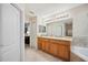 Bathroom features double sink vanity, tile floor, soaking tub, and lots of storage at 1888 Creeks Vista Blvd, Lakeland, FL 33810