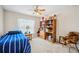 Cozy bedroom with ceiling fan, window, and ample space at 1888 Creeks Vista Blvd, Lakeland, FL 33810