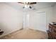 Bedroom with a ceiling fan, carpet flooring, and a closet at 1888 Creeks Vista Blvd, Lakeland, FL 33810