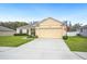 Charming single-story home with a manicured lawn and a two-car garage at 1888 Creeks Vista Blvd, Lakeland, FL 33810