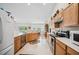 Bright kitchen featuring stainless steel appliances, tile flooring, and a functional layout at 1888 Creeks Vista Blvd, Lakeland, FL 33810