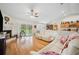 Bright living area with hardwood floors, fireplace, and sliding glass doors to the outdoors at 1888 Creeks Vista Blvd, Lakeland, FL 33810