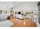 Bright living room with hardwood floors, vaulted ceilings, and a cozy fireplace at 1888 Creeks Vista Blvd, Lakeland, FL 33810