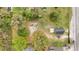 Aerial view of property with a spacious lot including a fire pit at 1925 N Combee Rd, Lakeland, FL 33801