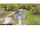 Aerial view of the freshly painted home showcasing the yard at 1925 N Combee Rd, Lakeland, FL 33801