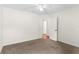 This bedroom features neutral carpet, freshly painted walls, and a ceiling fan at 1925 N Combee Rd, Lakeland, FL 33801