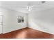 Bright bedroom with hardwood floors, a ceiling fan, fresh paint, and a window at 1925 N Combee Rd, Lakeland, FL 33801