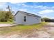 Rear exterior showcasing the backyard, fresh paint, and lush lawn at 1925 N Combee Rd, Lakeland, FL 33801