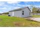 Exterior showing the freshly painted home, lawn, and landscape at 1925 N Combee Rd, Lakeland, FL 33801