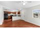 Functional kitchen featuring dark wood cabinets, sleek black appliances, and updated countertops at 1925 N Combee Rd, Lakeland, FL 33801