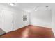 Bright living room featuring hardwood floors, a ceiling fan, a window, and a freshly painted interior at 1925 N Combee Rd, Lakeland, FL 33801