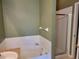 Bathroom featuring soaking tub and separate glass enclosed shower at 2051 Winterset Dr, Lakeland, FL 33813