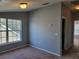 Bedroom featuring neutral walls, carpet and double-paned windows at 2051 Winterset Dr, Lakeland, FL 33813