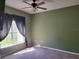 Bedroom with a ceiling fan, natural light, and neutral carpet at 2051 Winterset Dr, Lakeland, FL 33813