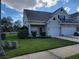 Charming townhouse with a well-manicured lawn and attached one car garage at 2051 Winterset Dr, Lakeland, FL 33813