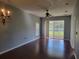 Spacious living room with hardwood floors and sliding glass doors at 2051 Winterset Dr, Lakeland, FL 33813