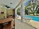 Community pool area with tables and chairs, offering a refreshing escape at 2051 Winterset Dr, Lakeland, FL 33813