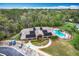 An aerial view of the community clubhouse, pool, and ample parking at 2206 Silver Lakes N Dr, Lakeland, FL 33810