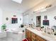 Bright bathroom featuring a garden tub, double vanity, and natural lighting at 2206 Silver Lakes N Dr, Lakeland, FL 33810