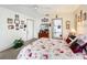 Bright bedroom featuring white walls, ceiling fan, and a doorway to the en suite bathroom at 2206 Silver Lakes N Dr, Lakeland, FL 33810