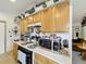 Bright kitchen with wooden cabinetry, white countertops, and stainless steel appliances at 2206 Silver Lakes N Dr, Lakeland, FL 33810