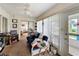 Relaxing sun room with a ceiling fan, comfortable seating, and sliding door access at 2206 Silver Lakes N Dr, Lakeland, FL 33810