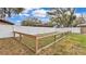 This tranquil backyard features a white fence, a small dog run, and green grass at 2330 Peterson Rd, Lakeland, FL 33812