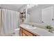Well-lit bathroom featuring a shower-tub, and updated fixtures at 2330 Peterson Rd, Lakeland, FL 33812