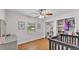 Charming bedroom with hardwood floors, closet, ceiling fan, and ample natural light at 2330 Peterson Rd, Lakeland, FL 33812