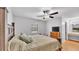 Comfortable bedroom featuring a ceiling fan, and dresser offering a serene retreat at 2330 Peterson Rd, Lakeland, FL 33812