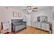 Comfortable bedroom with ceiling fan, and laminate flooring offers a warm and inviting atmosphere at 2330 Peterson Rd, Lakeland, FL 33812