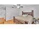 Relaxing bedroom with a wooden bed frame, ceiling fan, and a peaceful ambiance at 2330 Peterson Rd, Lakeland, FL 33812