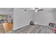 Large bonus room with wood-look floors offers flexible living space and backyard access at 2330 Peterson Rd, Lakeland, FL 33812
