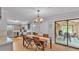 Charming dining area seamlessly connects the kitchen to the outdoor sunroom at 2330 Peterson Rd, Lakeland, FL 33812