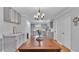 Bright dining room with hardwood flooring and modern light fixture at 2330 Peterson Rd, Lakeland, FL 33812